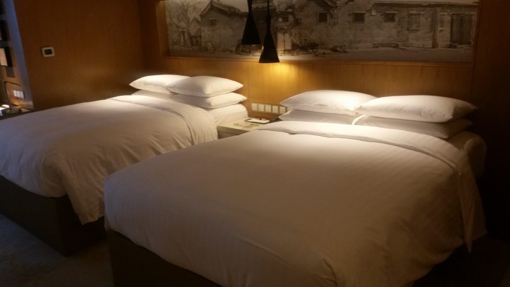 Beijing A hotel bed with white sheets in Beijing China
