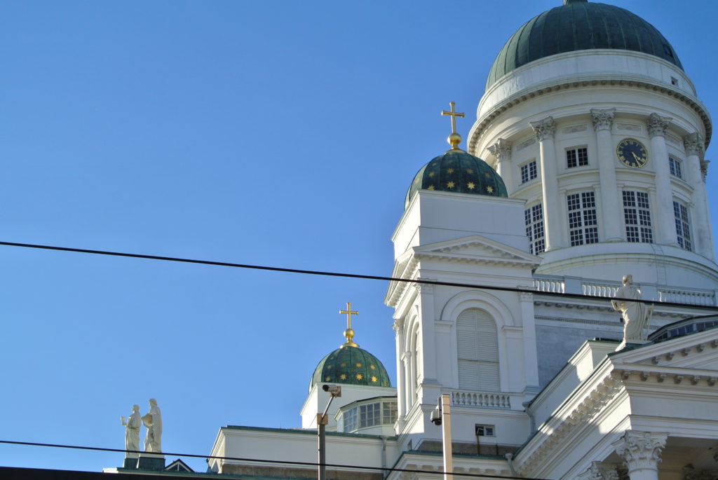 Beautiful Helsinki Senate Square church in the sunshine against blue sky Helsingin Tuomiokirkko auringonpaisteessa