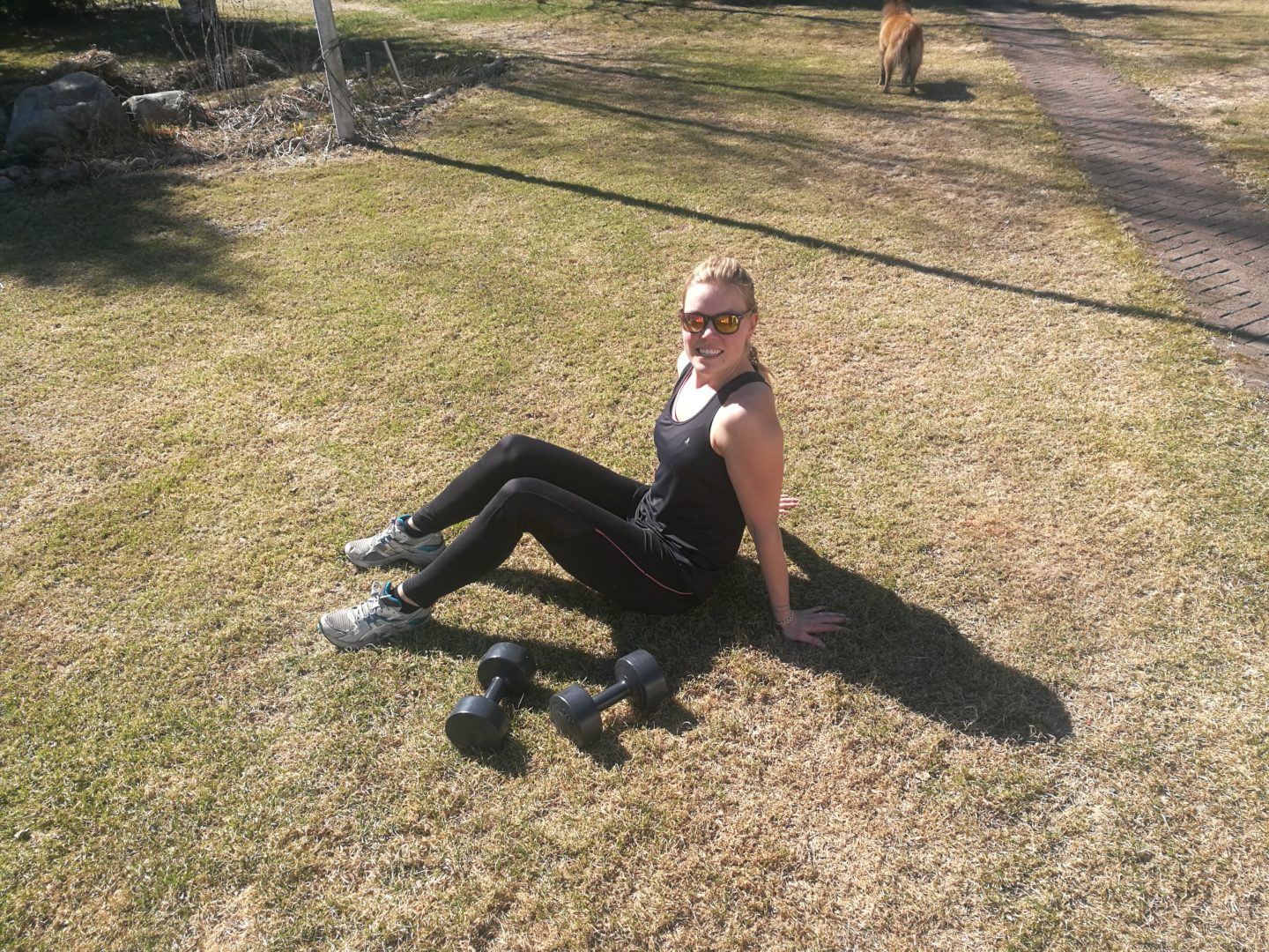 Work work Annimarian A blonde girl sitting on the grass after a workout