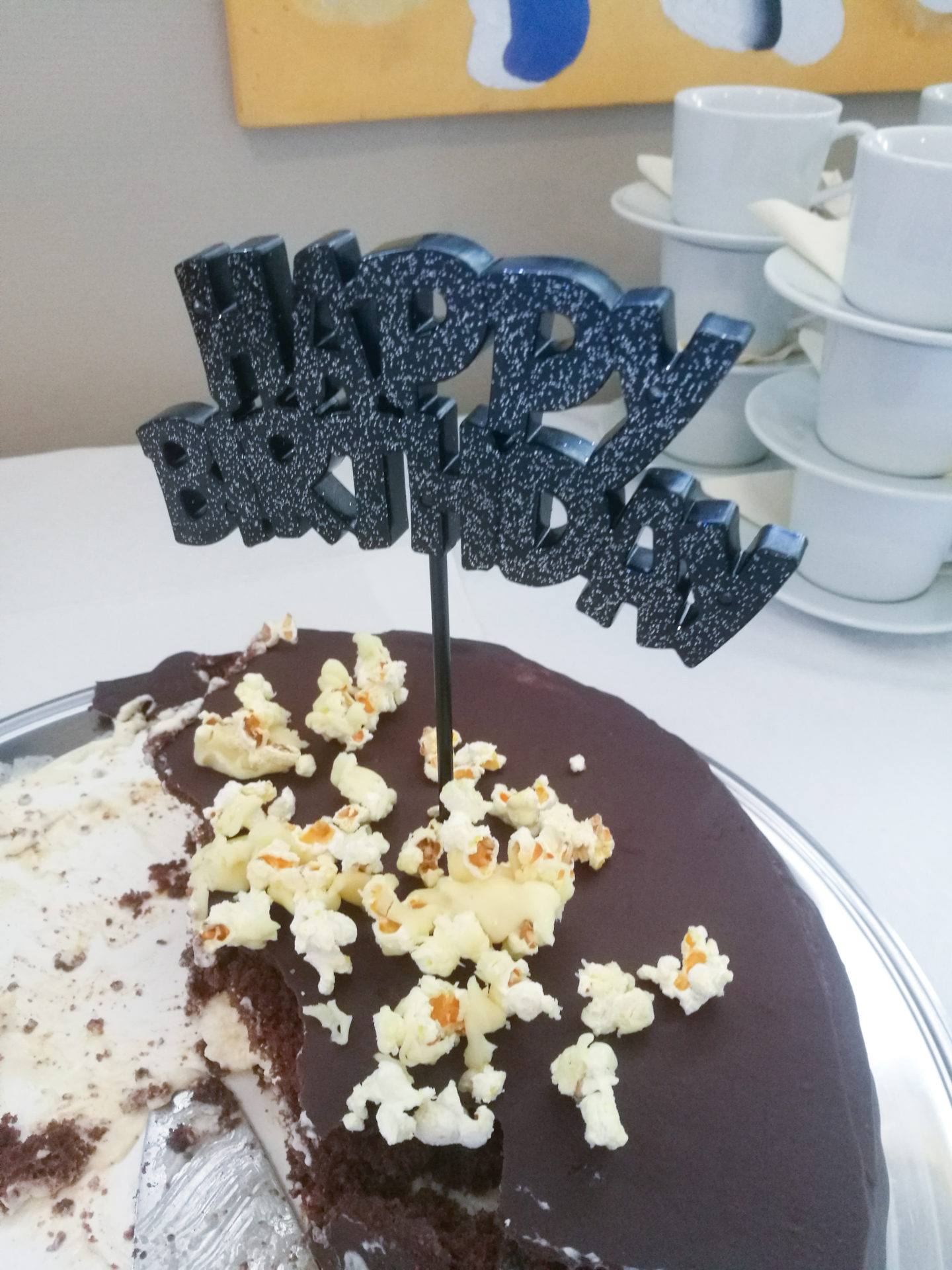 Weekend in pictures A half eaten bithday cake with a happy birthday sign on it